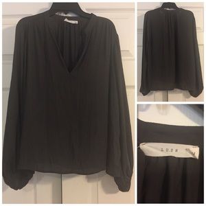 Lush dark gray v-neck shirt